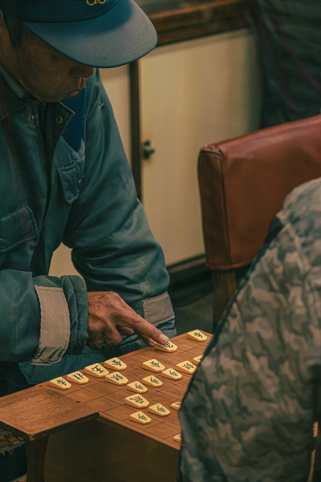 Elderly Japanese people playing a board game together
