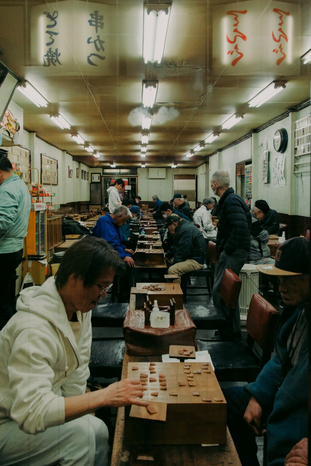 Elderly Japanese people doing a craft workshop together