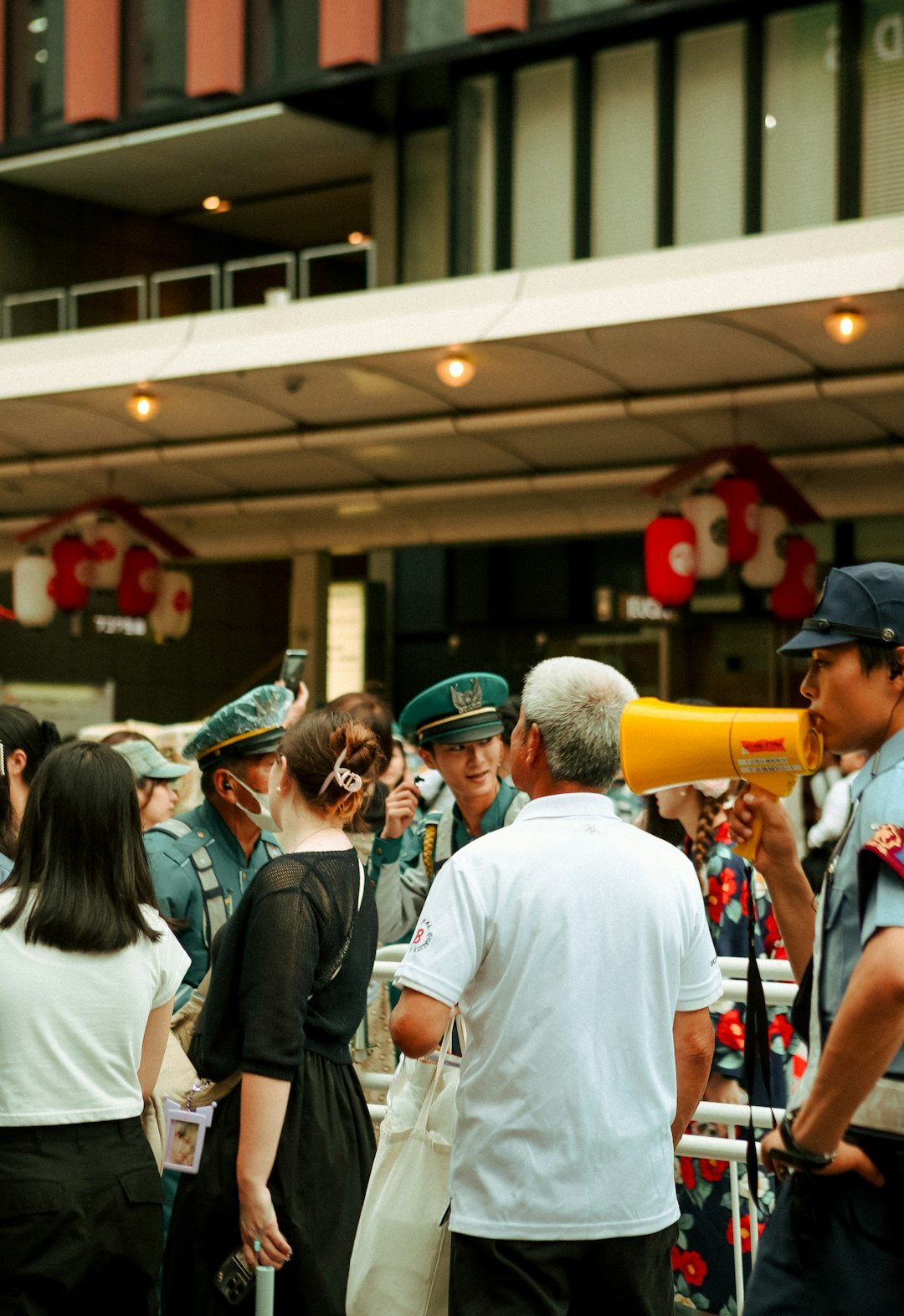 Group of Japanese staff and elderly volunteers smiling together