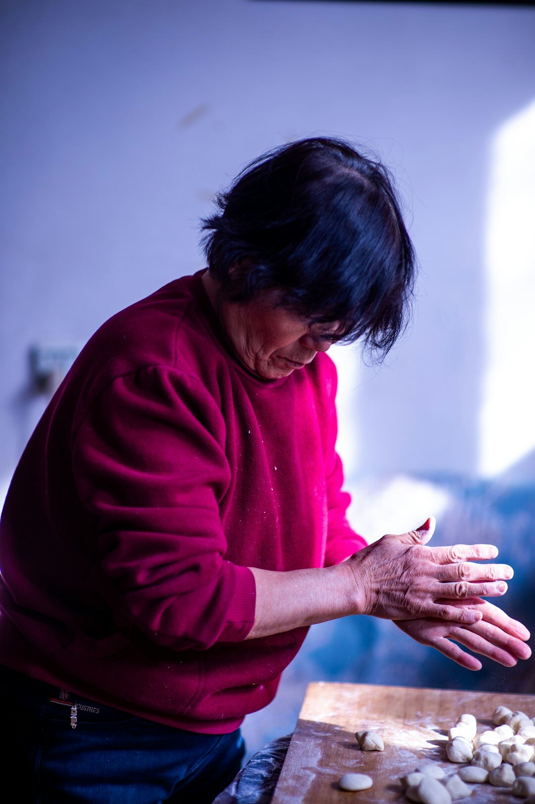 elderly woman cooking at home