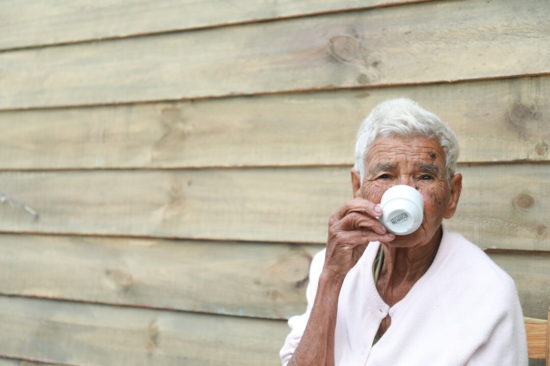 senior drinking water after exercise