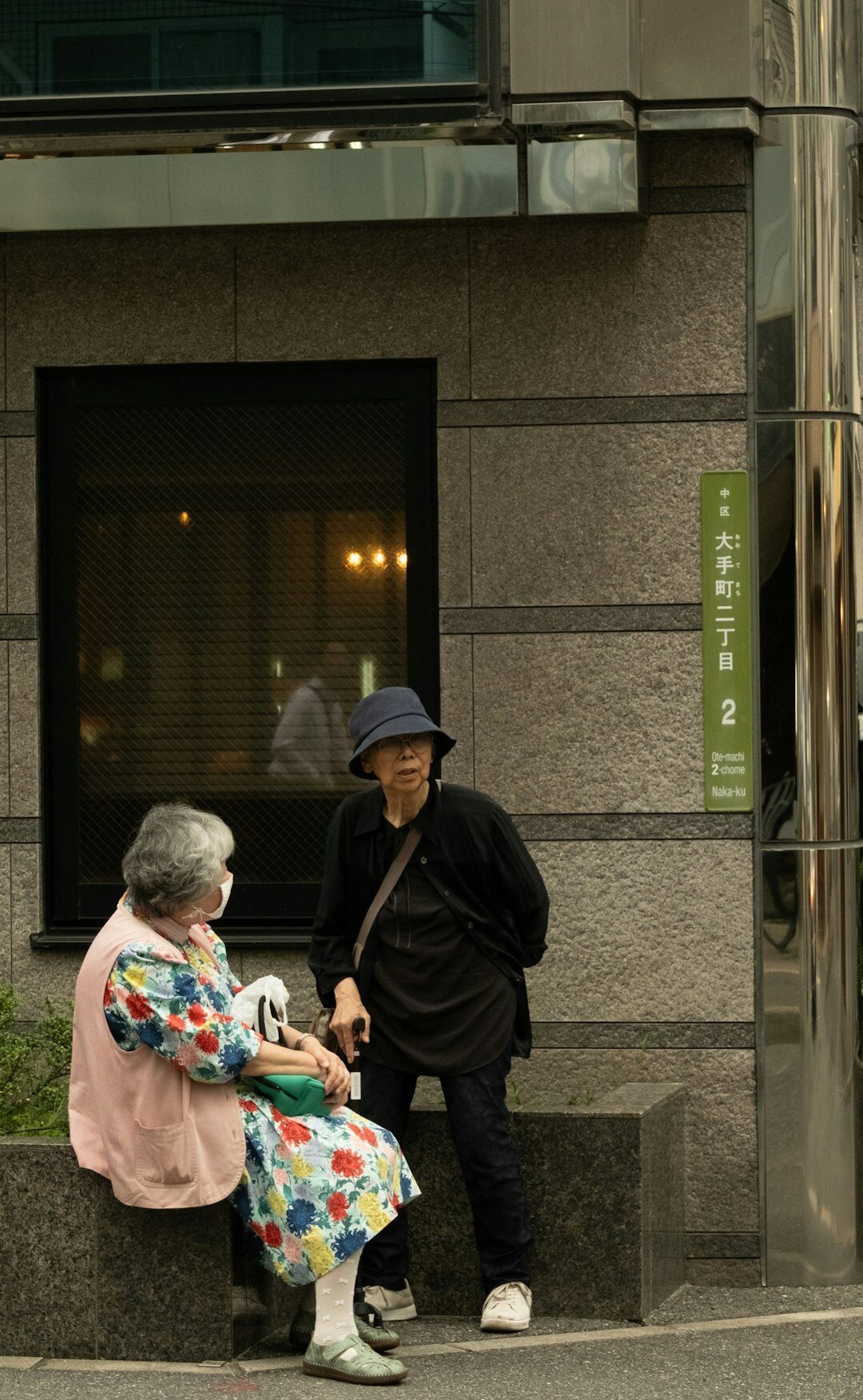 Happy elderly Japanese woman holding a membership card