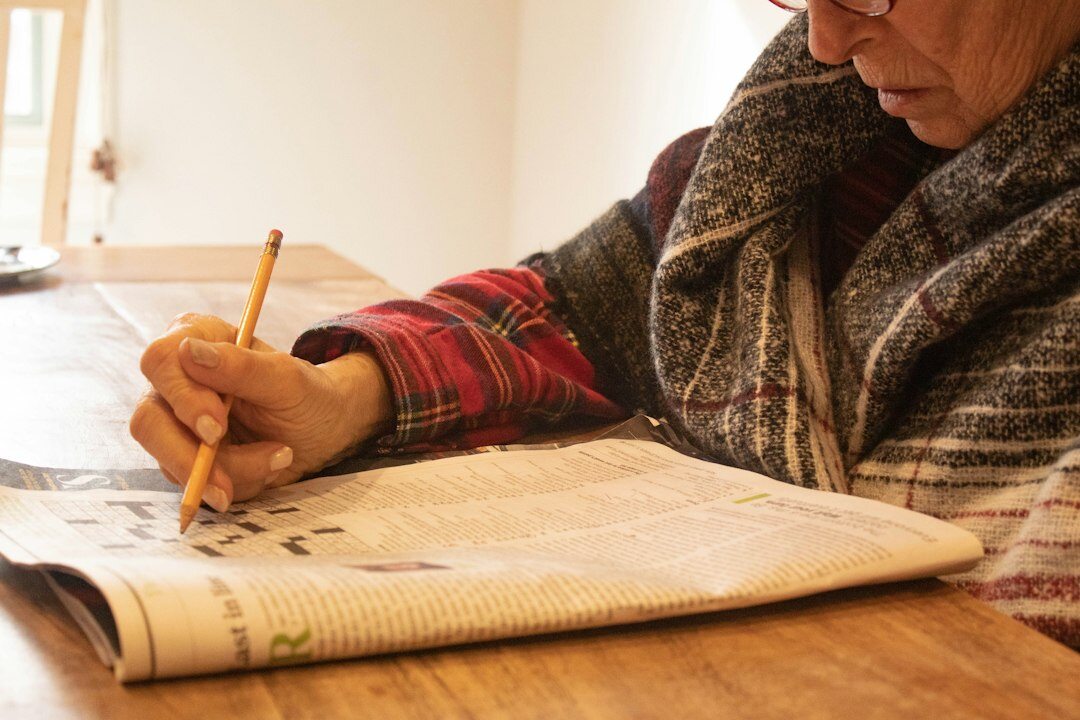 elderly woman reading documents
