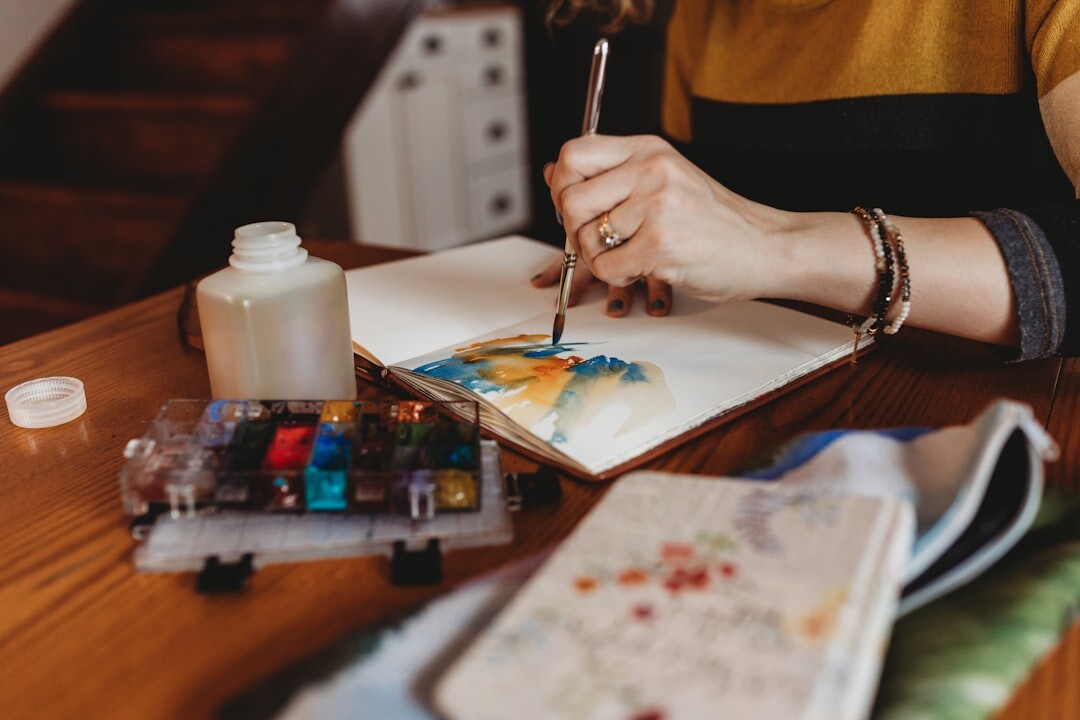 senior woman painting watercolor