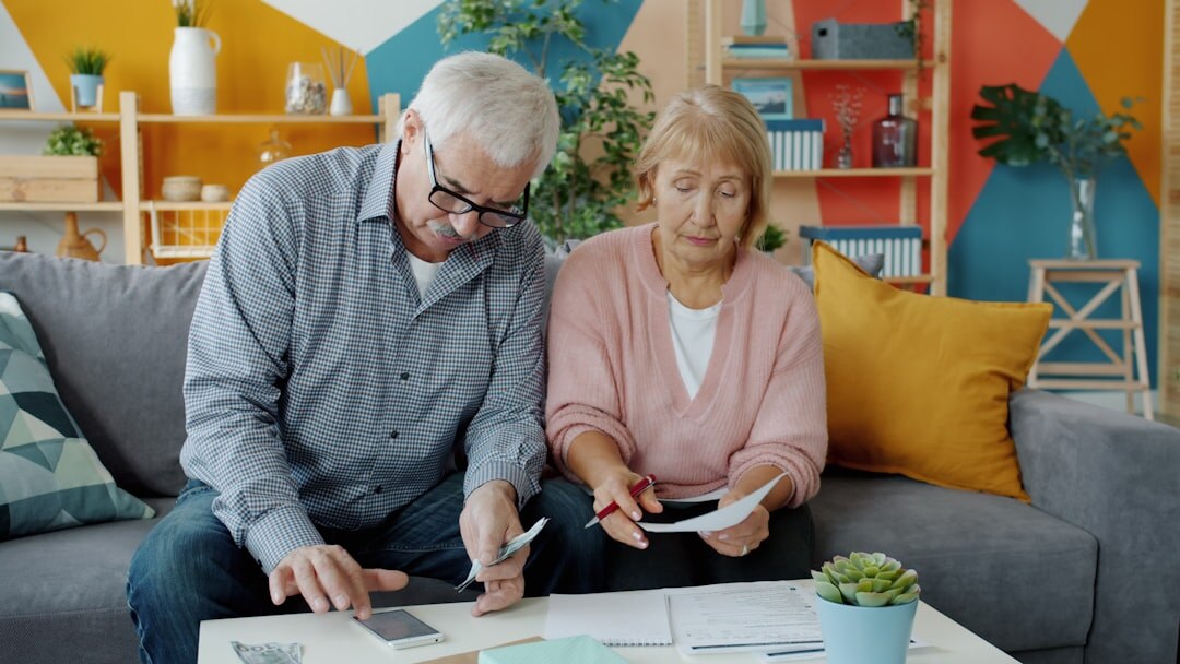 senior citizen filling tax forms